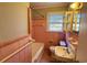 Bathroom with pink tile, bathtub, and vanity at 1916 Calhoun St., Georgetown, SC 29440