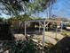 Open carport in the backyard with gravel base at 1916 Calhoun St., Georgetown, SC 29440