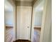 Hallway with doors to bedrooms and hardwood floors at 1916 Calhoun St., Georgetown, SC 29440