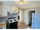 Kitchen with white cabinets and electric stove at 1916 Calhoun St., Georgetown, SC 29440