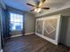 Bedroom with wood-look floors, window, and built-in wall bed at 1925 Bent Grass Dr. # B, Surfside Beach, SC 29575