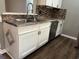 White cabinets, granite countertop, and stainless steel sink and dishwasher in kitchen at 1925 Bent Grass Dr. # B, Surfside Beach, SC 29575