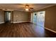 Living room with sliding glass door to screened porch and wood-look floors at 1925 Bent Grass Dr. # B, Surfside Beach, SC 29575