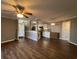 Open living room and kitchen with wood-look floors and ceiling fan at 1925 Bent Grass Dr. # B, Surfside Beach, SC 29575