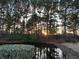 Peaceful pond with lush greenery and sunset view at 1925 Bent Grass Dr. # B, Surfside Beach, SC 29575