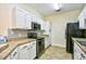 Galley kitchen with white cabinetry and stainless steel appliances at 213 Wando River Rd. # 11-G, Myrtle Beach, SC 29579