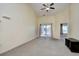 Bright living room with vaulted ceilings, sliding glass door to balcony, and carpet flooring at 213 Wando River Rd. # 11-G, Myrtle Beach, SC 29579