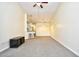 Bright living room featuring modern lighting, neutral carpet, and a breakfast bar at 213 Wando River Rd. # 11-G, Myrtle Beach, SC 29579