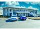 Parking lot view of condo with two cars parked on marked parking spaces at 213 Wando River Rd. # 11-G, Myrtle Beach, SC 29579