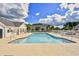 Relaxing community pool surrounded by a fence, buildings and sky at 213 Wando River Rd. # 11-G, Myrtle Beach, SC 29579