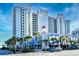 Oceanfront high-rise building with balconies and palm trees at 2401 S Ocean Blvd. # 363, Myrtle Beach, SC 29577