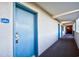 Hotel hallway with blue doors and carpeted floor at 2401 S Ocean Blvd. # 363, Myrtle Beach, SC 29577