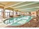 Indoor heated pool with large windows and seating area at 2401 S Ocean Blvd. # 363, Myrtle Beach, SC 29577