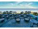 Outdoor patio area with tables, chairs, and umbrellas overlooking the ocean at 2401 S Ocean Blvd. # 363, Myrtle Beach, SC 29577