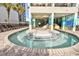 Relaxing curved pool and hot tub with surrounding patio at 2401 S Ocean Blvd. # 363, Myrtle Beach, SC 29577
