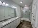 Bathroom boasts double vanity, granite countertop, and a walk-in shower at 2509 Ye Olde Kings Hwy., North Myrtle Beach, SC 29582