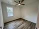 Simple bedroom with wood-look floors and a window at 2509 Ye Olde Kings Hwy., North Myrtle Beach, SC 29582