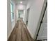 Clean hallway with light walls and wood-look floors at 2509 Ye Olde Kings Hwy., North Myrtle Beach, SC 29582