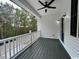 Covered porch overlooks a tree-lined street, perfect for relaxing at 2509 Ye Olde Kings Hwy., North Myrtle Beach, SC 29582