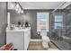 Modern bathroom with white vanity and walk-in shower at 2560 Ellerbe Circle, Myrtle Beach, SC 29588