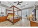 Main bedroom with a wooden four-poster bed, and access to a private balcony at 2560 Ellerbe Circle, Myrtle Beach, SC 29588