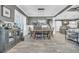 Bright dining room features a wooden table with six chairs and a built-in hutch at 2560 Ellerbe Circle, Myrtle Beach, SC 29588