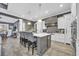 Elegant kitchen with white and gray cabinets, an island with seating, and stainless steel appliances at 2560 Ellerbe Circle, Myrtle Beach, SC 29588