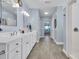 Double vanity bathroom with light blue walls and tile floor at 274 Avenue Of The Palms, Myrtle Beach, SC 29579