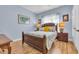 Quaint bedroom with a wooden bed and light blue walls at 274 Avenue Of The Palms, Myrtle Beach, SC 29579