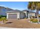 Charming one-story house with a two-car garage and manicured lawn at 274 Avenue Of The Palms, Myrtle Beach, SC 29579