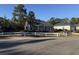 Tan house with a white fence and detached garage at 2958 Mary Hines Ln., Georgetown, SC 29440