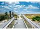 Wooden boardwalk leads to sandy beach, featuring ocean views at 3000 N Ocean Blvd. # 333, Myrtle Beach, SC 29577