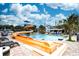 Large swimming pool with waterslide and lounge chairs at 3000 N Ocean Blvd. # 333, Myrtle Beach, SC 29577