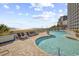 Oceanfront pool and sundeck with lounge chairs at 3000 Ocean Blvd. N # 1905, Myrtle Beach, SC 29577