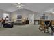 Spacious living room with vaulted ceiling, carpet flooring, and ample natural light at 3035 Dewberry Dr., Conway, SC 29527