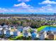 Aerial view of houses near the ocean with a community pond at 304 Spartina Ct., North Myrtle Beach, SC 29582