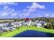 Aerial view of a house situated on a pond in a residential area at 304 Spartina Ct., North Myrtle Beach, SC 29582