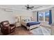 Comfortable bedroom with a queen-size bed, hardwood floors and large windows at 304 Spartina Ct., North Myrtle Beach, SC 29582