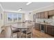 Casual dining area with round table and chairs, adjacent to a kitchen at 304 Spartina Ct., North Myrtle Beach, SC 29582