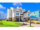 Two-story home with white siding, brick accents, and a two-car garage at 304 Spartina Ct., North Myrtle Beach, SC 29582