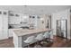 Modern kitchen with white cabinets, large island, and stainless steel appliances at 304 Spartina Ct., North Myrtle Beach, SC 29582