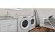 Convenient laundry room with Whirlpool washer and dryer, and utility sink at 304 Spartina Ct., North Myrtle Beach, SC 29582