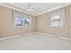 Bedroom with neutral walls, carpet, and two windows at 324 56Th Ave. N, North Myrtle Beach, SC 29582