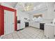 Galley kitchen with white cabinets and red walls at 324 56Th Ave. N, North Myrtle Beach, SC 29582