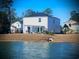 Home's backyard with a pergola, patio and lake view at 340 N Reindeer Rd., Surfside Beach, SC 29575