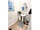 Small bathroom with pedestal sink and wood-look tile floor at 340 N Reindeer Rd., Surfside Beach, SC 29575