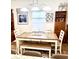 Dining room with table, bench, and coastal-themed art at 340 N Reindeer Rd., Surfside Beach, SC 29575