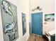 Beach-themed entryway with artwork and a light blue door at 340 N Reindeer Rd., Surfside Beach, SC 29575