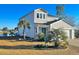 Two-story home with attractive landscaping and lake view at 340 N Reindeer Rd., Surfside Beach, SC 29575