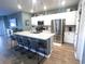 Kitchen with island, stainless steel appliances, and granite countertops at 340 N Reindeer Rd., Surfside Beach, SC 29575